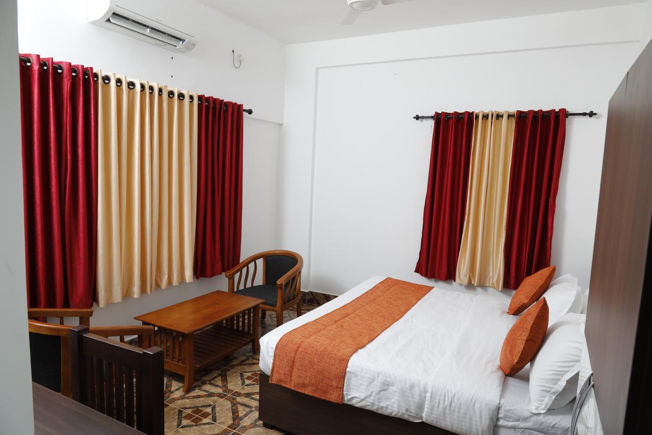Puthens Clifton Inn Kottayam Exteriör bild